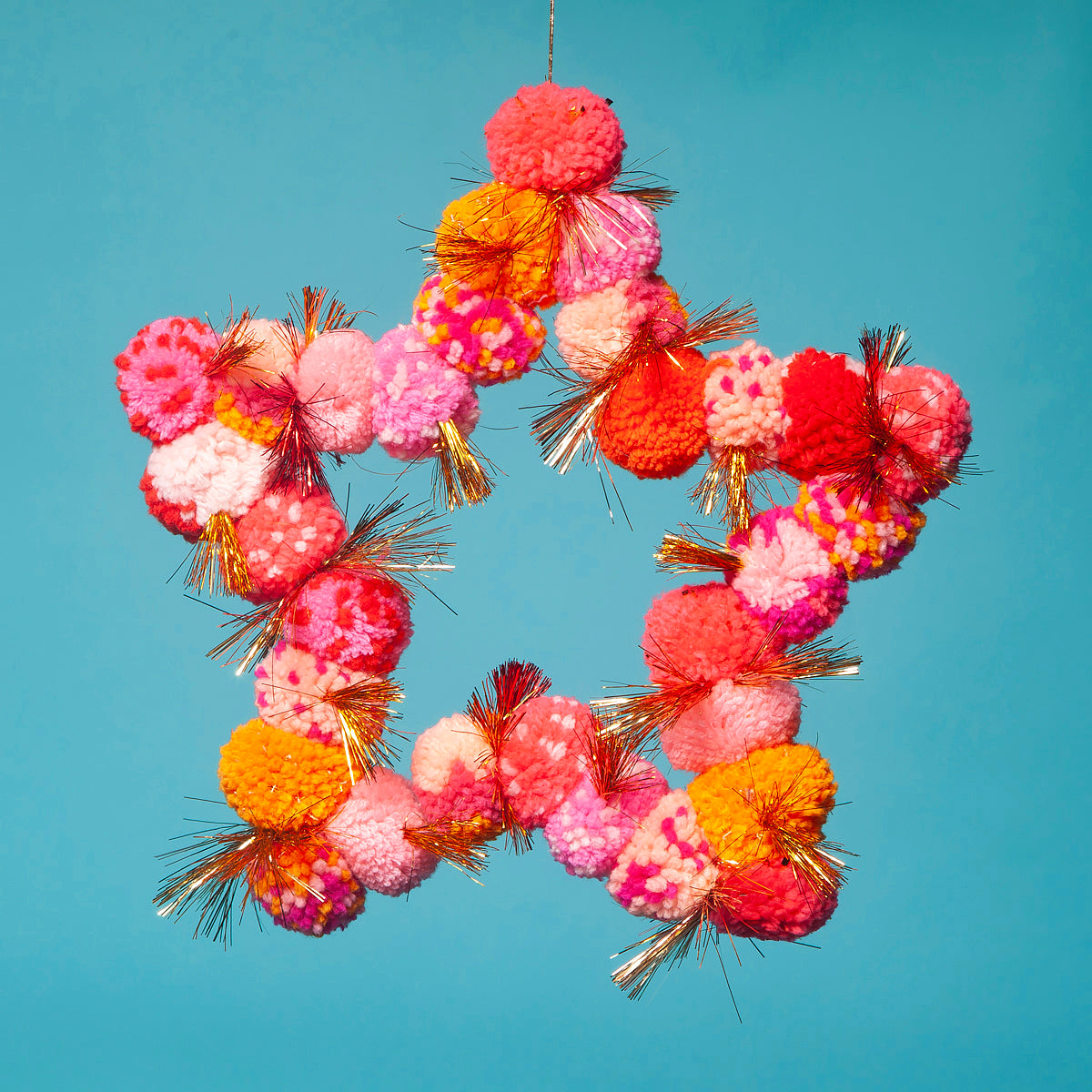 Pom Pom star hanging orange / pink-Little Fish Co.