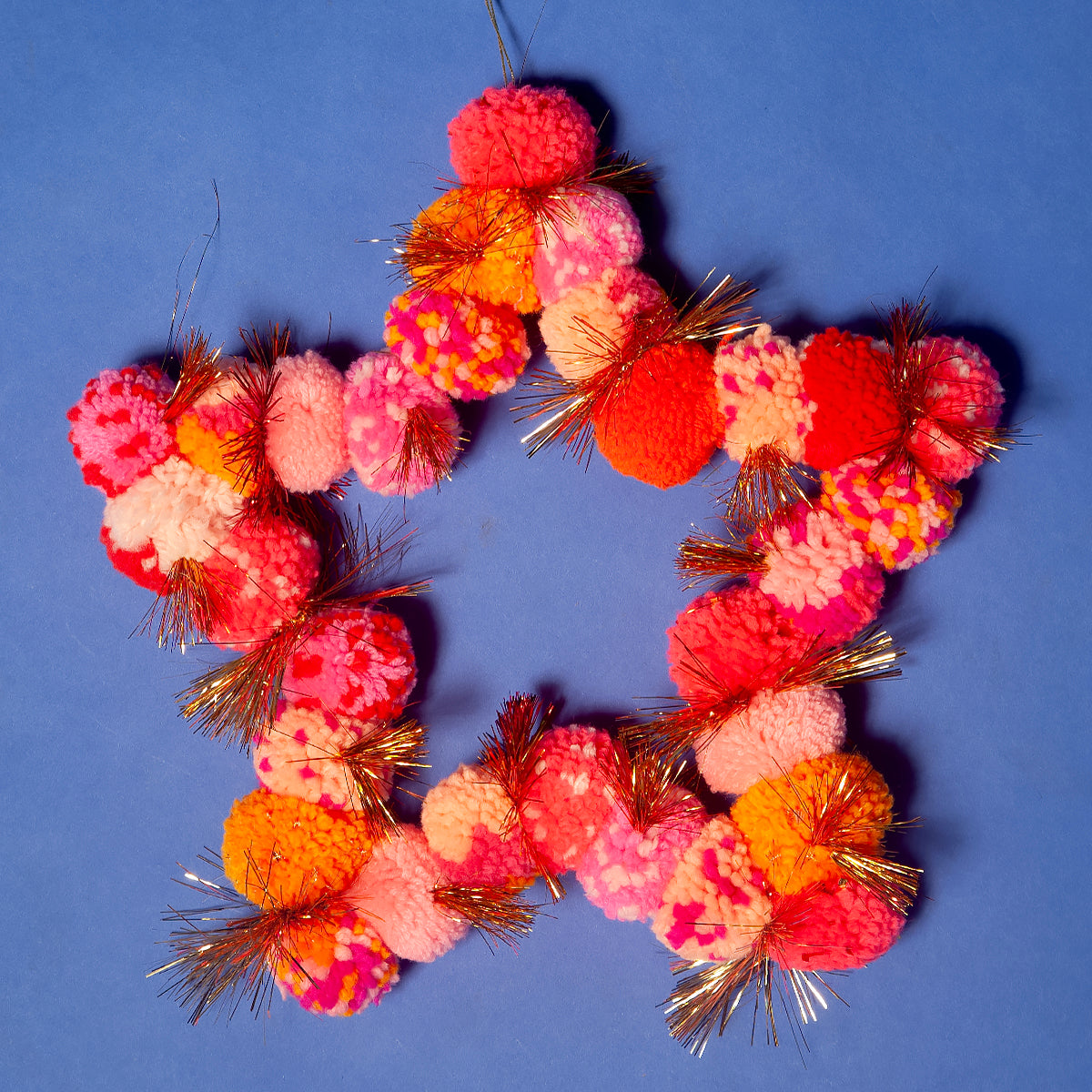 Pom Pom star hanging orange / pink-Little Fish Co.