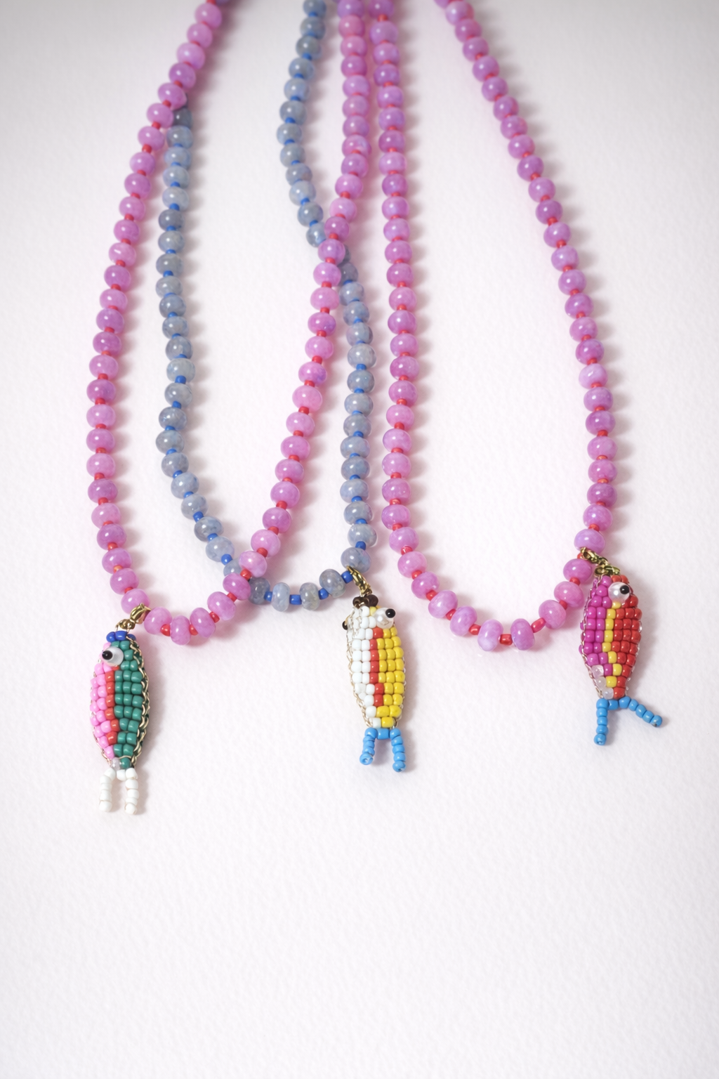 Stone necklace with fish pendant