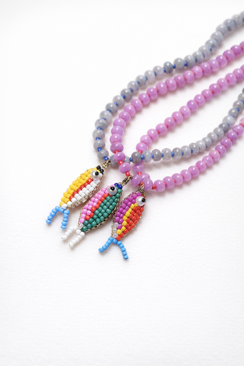 Stone necklace with fish pendant
