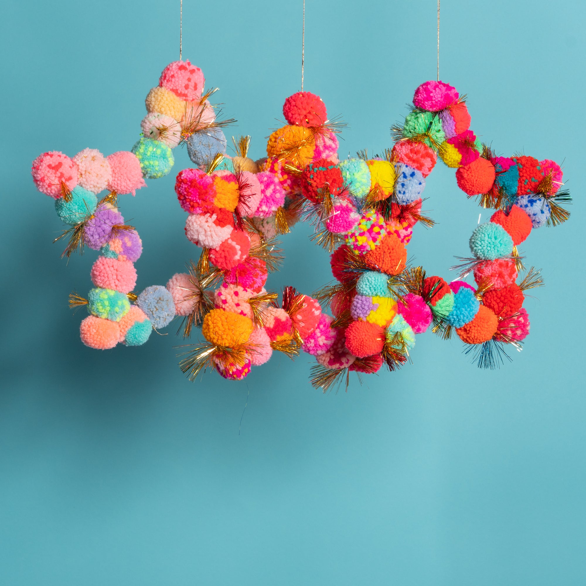 Pom Pom star hanging orange / pink-Little Fish Co.