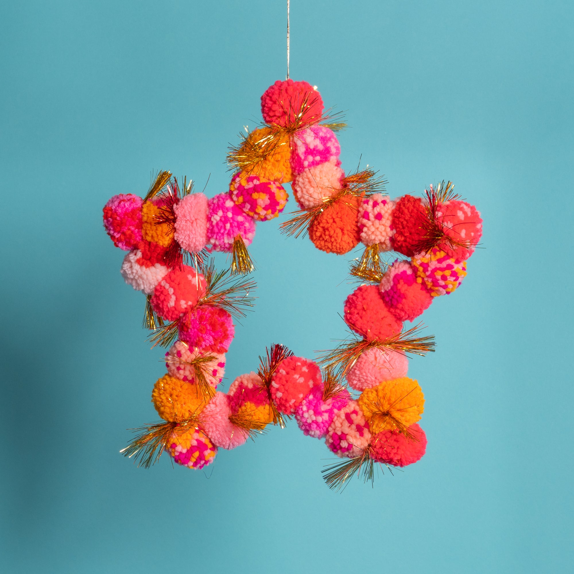 Pom Pom star hanging orange / pink-Little Fish Co.