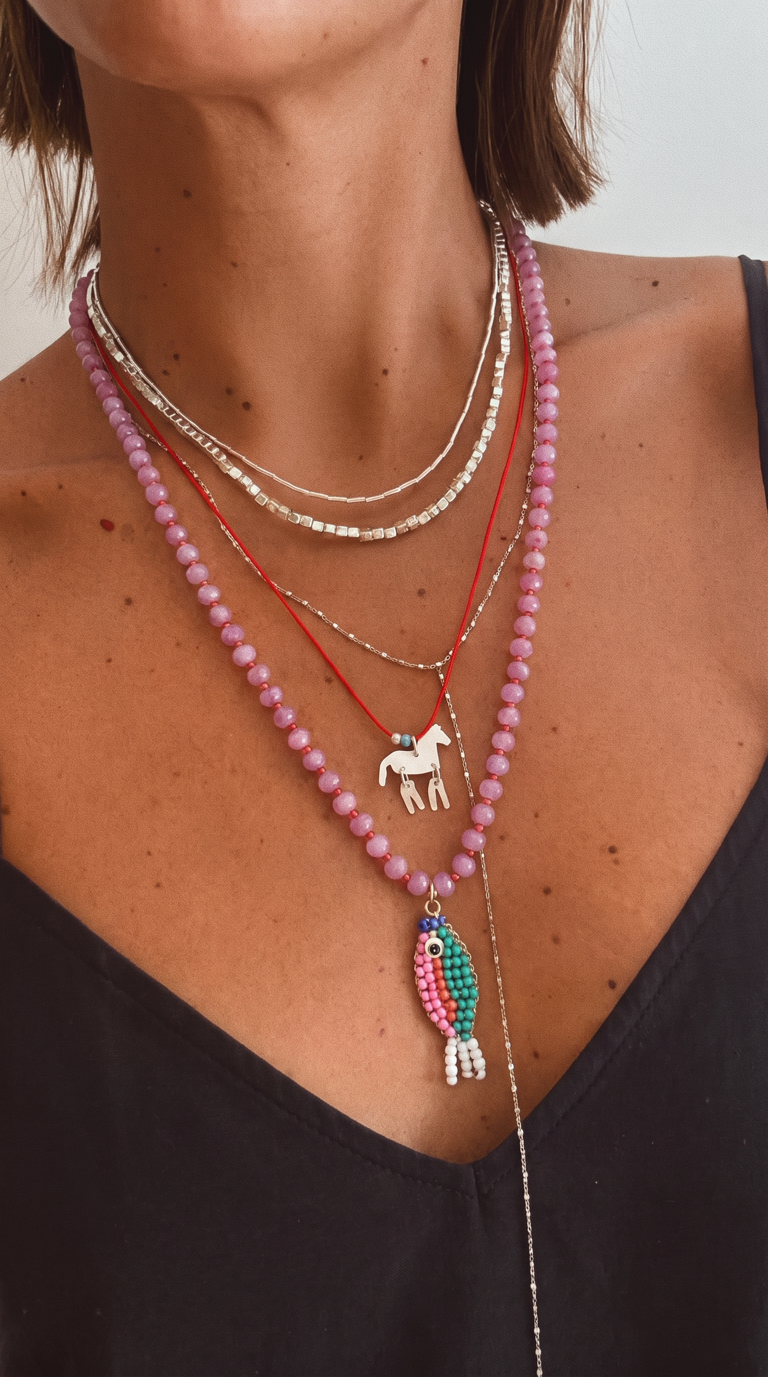 Stone necklace with fish pendant