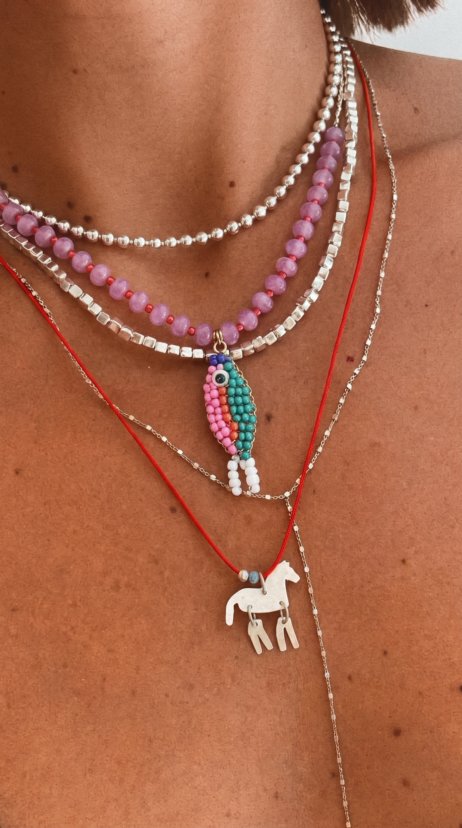Stone necklace with fish pendant